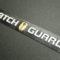 Watch Guard embossed nameplate printed by Marking Systems with a black background and white letters.