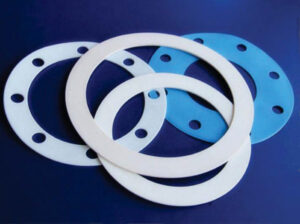 Four gaskets from Marking Systems for die-cut label printing staggard stacked on one another.