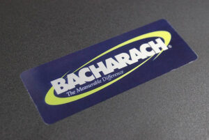 Bacharach transparent ink nameplate printed at Marking Systems.