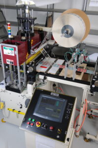 Precision cutting machine for labels manufactured by Marking Systems Inc. Garland, TX